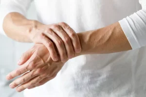 close up of female clutching wrist